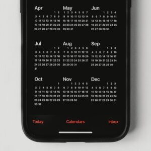 A mobile phone with a calendar on the screen.